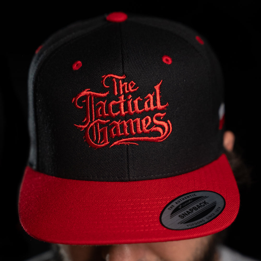 The Tactical Games Cap Black/Red - close-up of embroidered logo